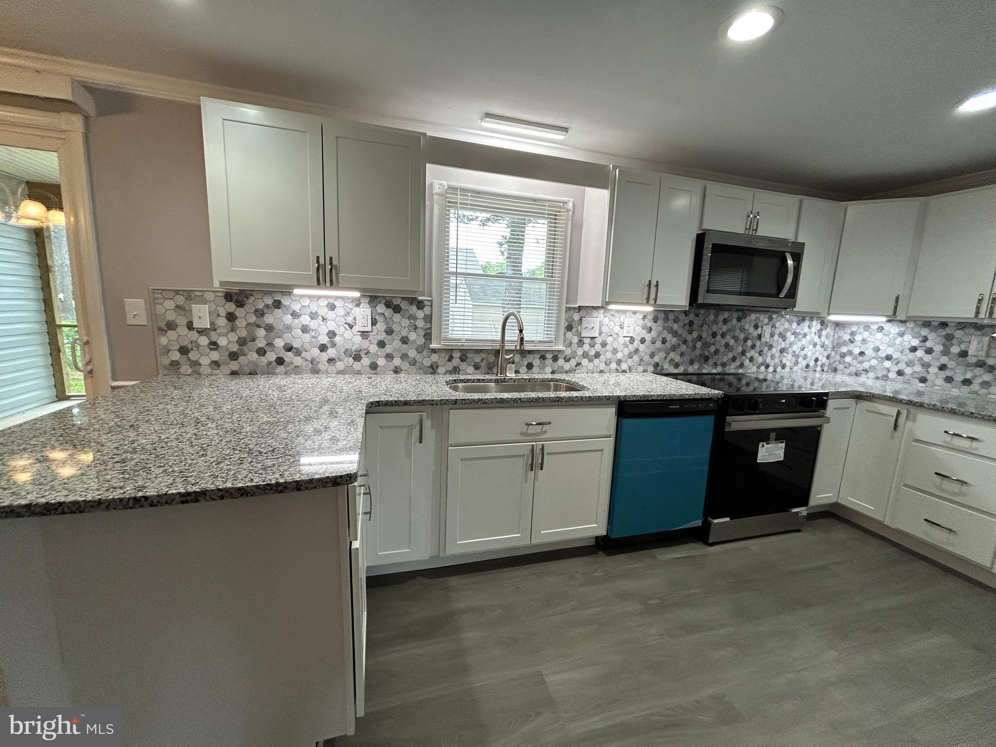 36697 Clubhouse Road Ocean View, DE 19970 - Photo 38 of 57 White and gray with stainless - timeless