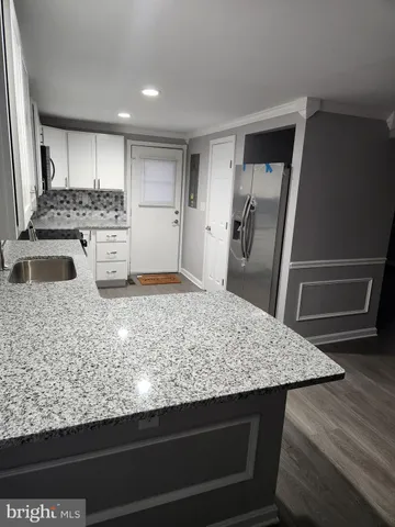 a view of house with outdoor space and parking