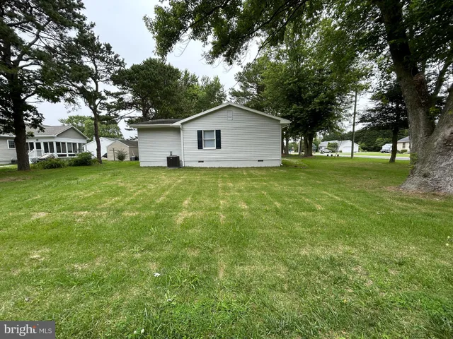 a house with a tree in front of it