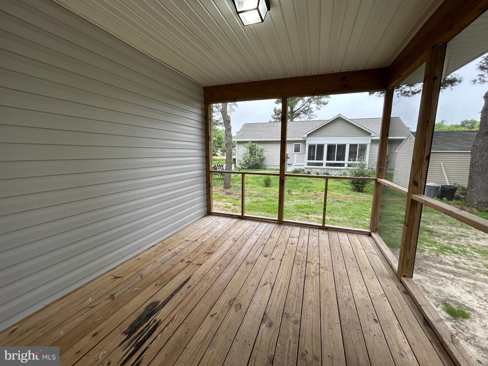 36697 Clubhouse Road Ocean View, DE 19970 - Photo 41 of 57 Enjoy those summer nights in your screened porch.