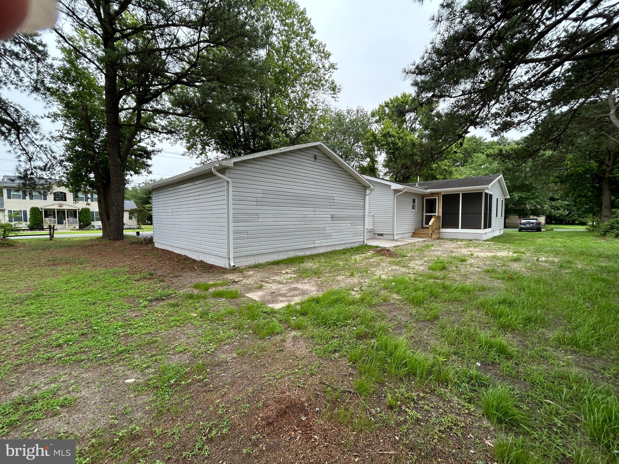 36697 Clubhouse Road Ocean View, DE 19970 - Photo 48 of 57 From the rear of the lot, view of rear of garage.