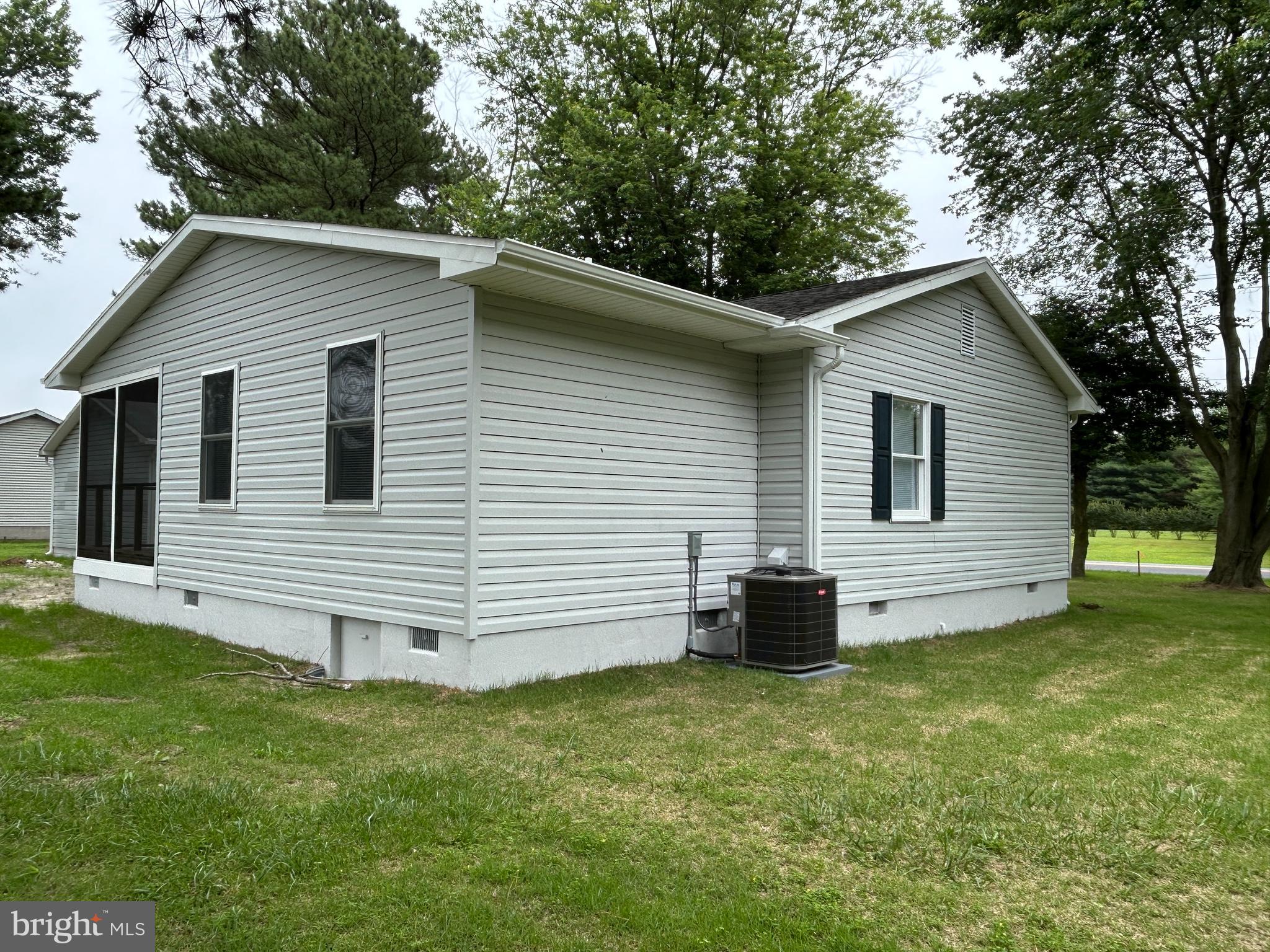 36697 Clubhouse Road Ocean View, DE 19970 - Photo 5 of 57 Looking at the side and rear of the home.