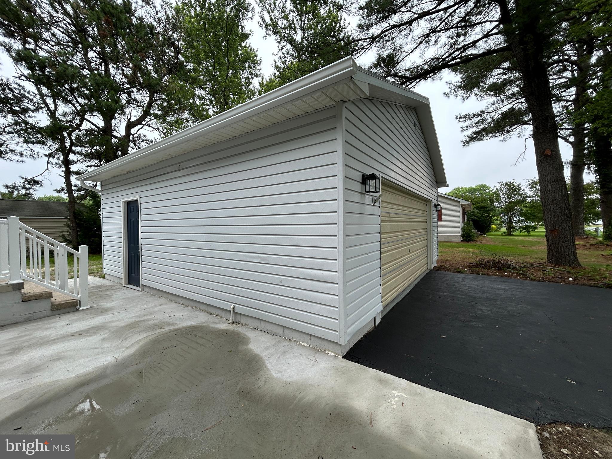 36697 Clubhouse Road Ocean View, DE 19970 - Photo 55 of 57 Garage Entry Door and Car Door