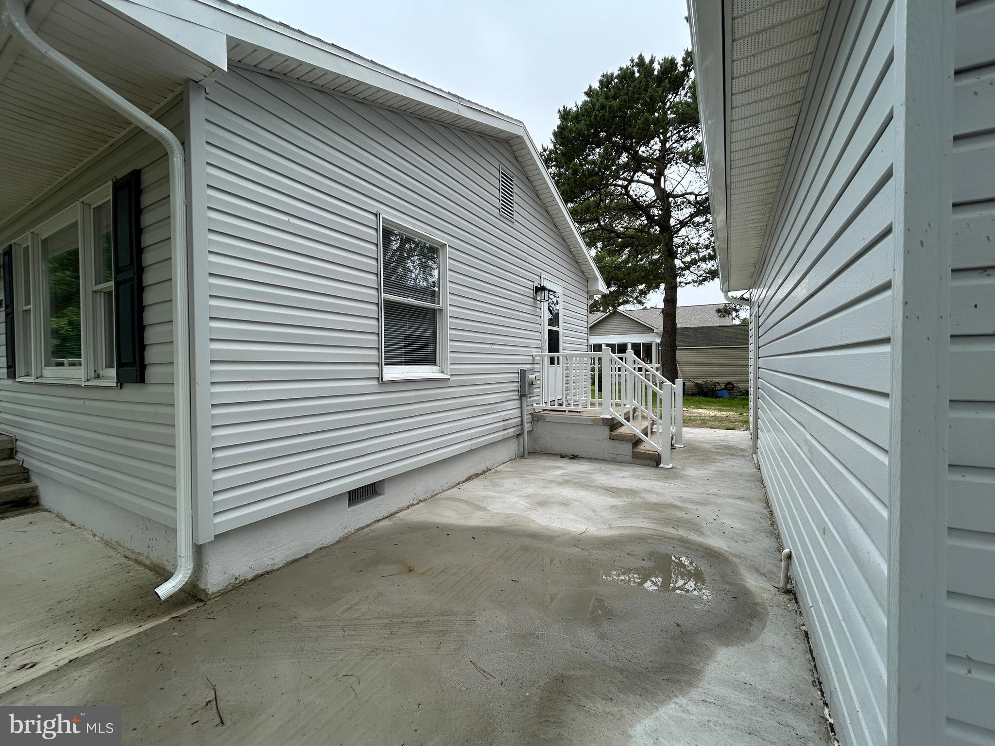 36697 Clubhouse Road Ocean View, DE 19970 - Photo 56 of 57 Space between the home and garage