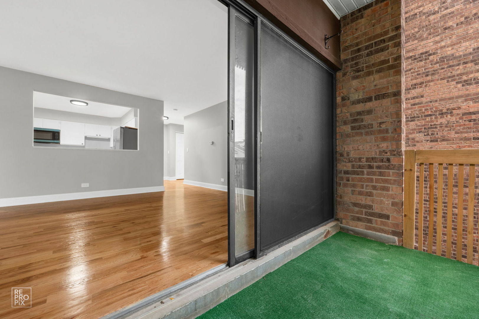 3110 Pheasant Creek Drive, Unit 206 Northbrook, IL 60062 - Photo 11 of 11 a view of an empty room with wooden floor and a window