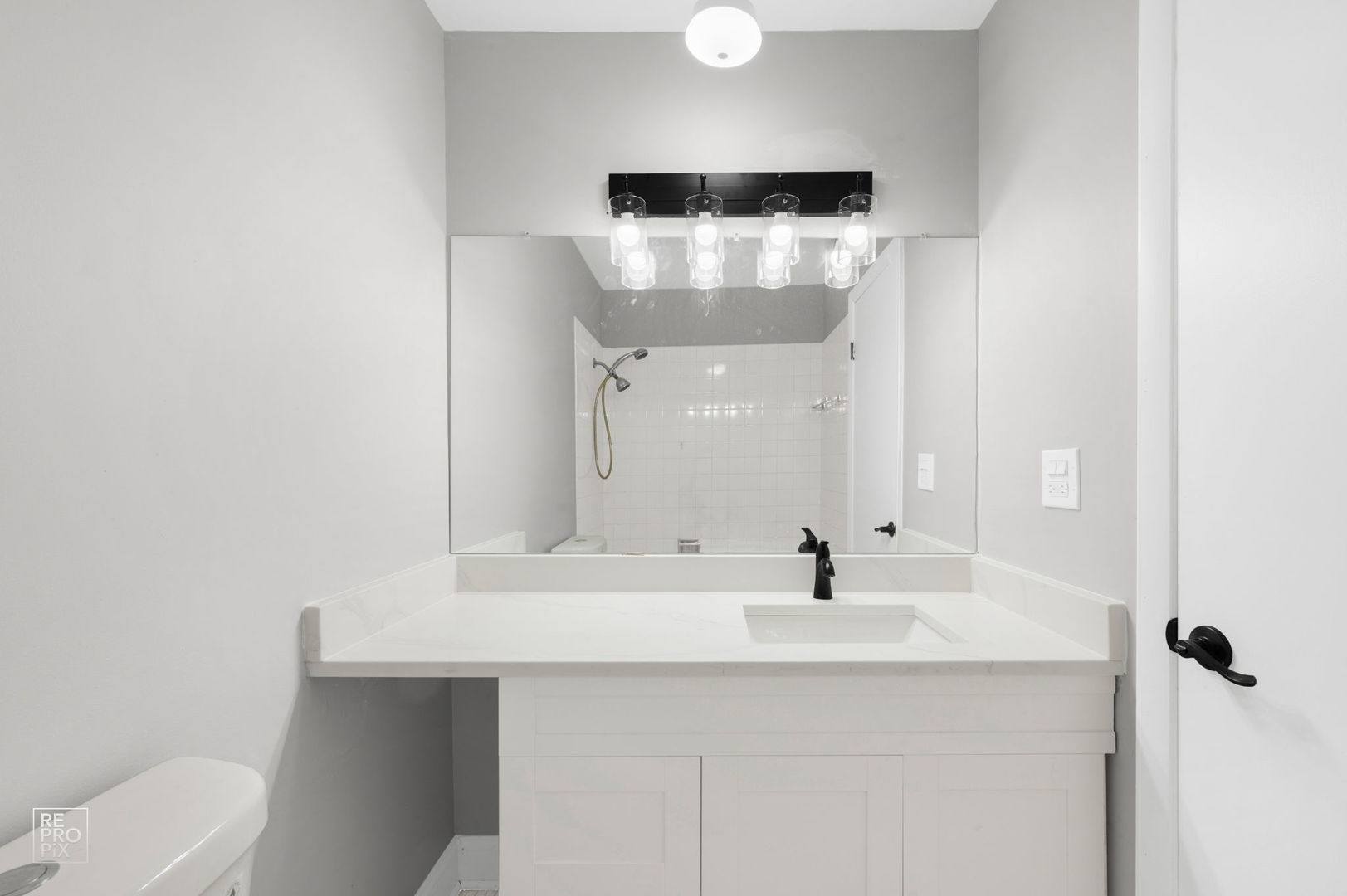 3110 Pheasant Creek Drive, Unit 206 Northbrook, IL 60062 - Photo 10 of 11 a bathroom with a sink and a mirror