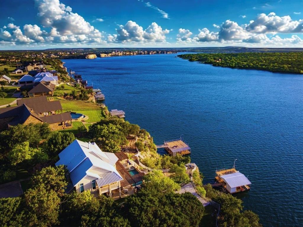 1003 Mesquite Ridge Graford, TX 76449 - Photo 1 of 40 GORGEOUS HELLS'S GATE VIEW, 4bd,3ba LAKEHOME with a DOUBLE LEVEL DOCK & INFINITY POOL & SPA on a 1AC LOT at PK LAKE