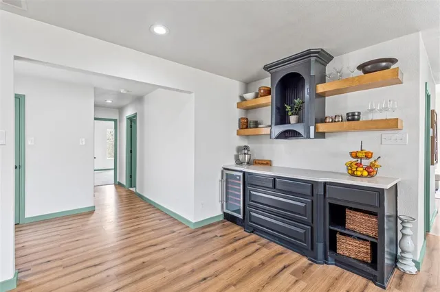 a view of room with wooden floor