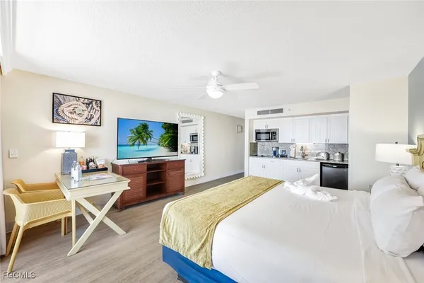 a bedroom with a bed and a chair