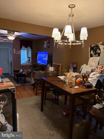 a room with furniture and chandelier