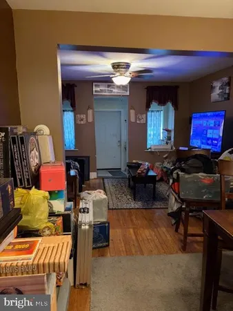 a living room with furniture and a mirror