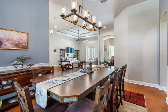 a kitchen with stainless steel appliances granite countertop a refrigerator and a stove