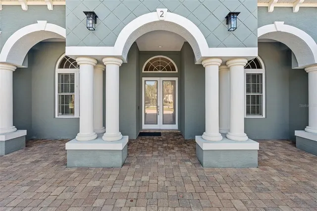 a view of a livingroom with furniture hardwood floor and a chandelier