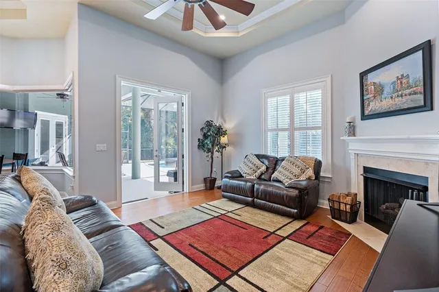 a spacious bathroom with a tub sink and mirror