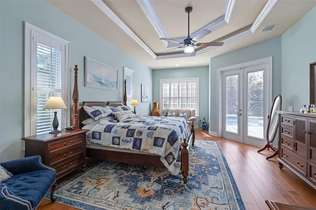 a view of walk in closet with clothes