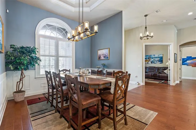 a kitchen with granite countertop a sink stove and cabinets