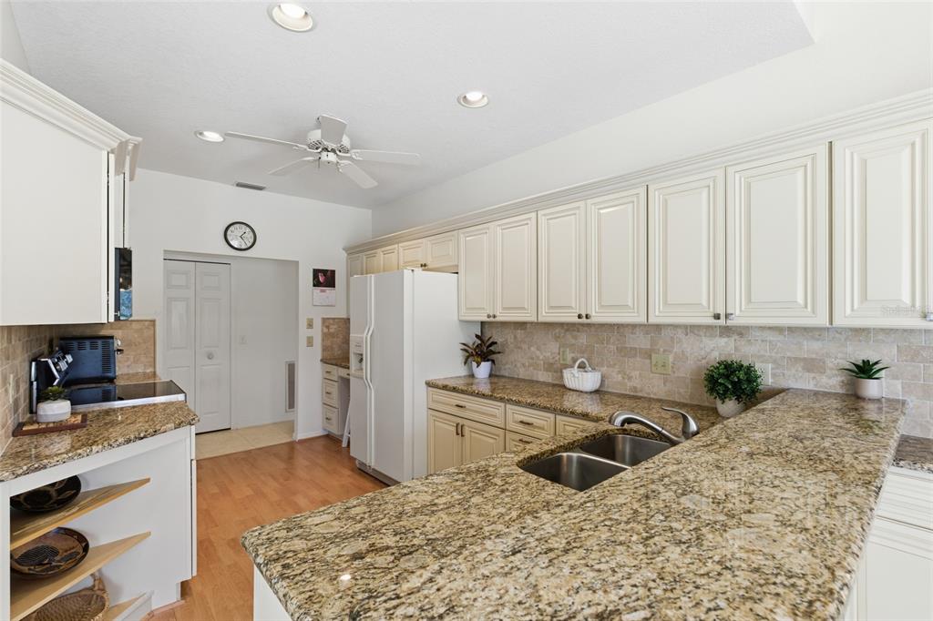 4030 Key Largo Lane Punta Gorda, FL 33955 - Photo 15 of 78 a kitchen with granite countertop a sink stove and refrigerator