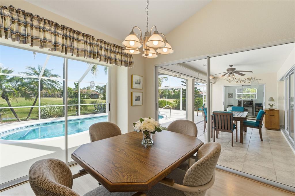 4030 Key Largo Lane Punta Gorda, FL 33955 - Photo 17 of 78 a view of a dining room with furniture wooden floor and chandelier