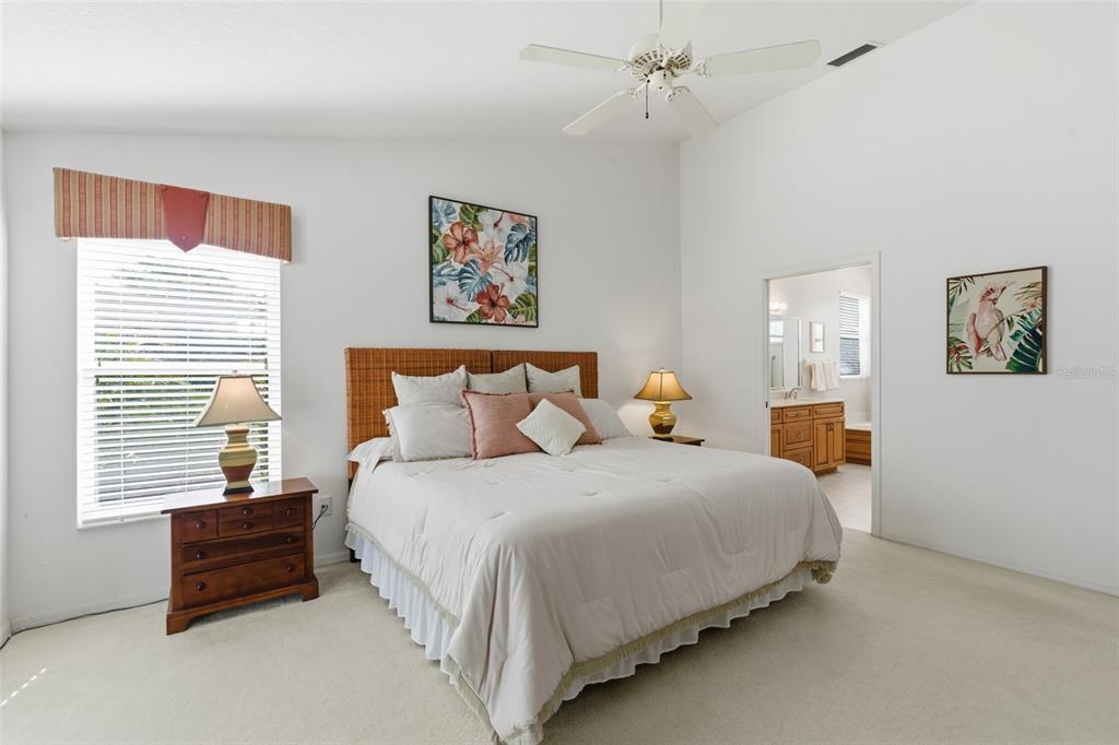 4030 Key Largo Lane Punta Gorda, FL 33955 - Photo 24 of 78 a bedroom with bed and paintings on the wall