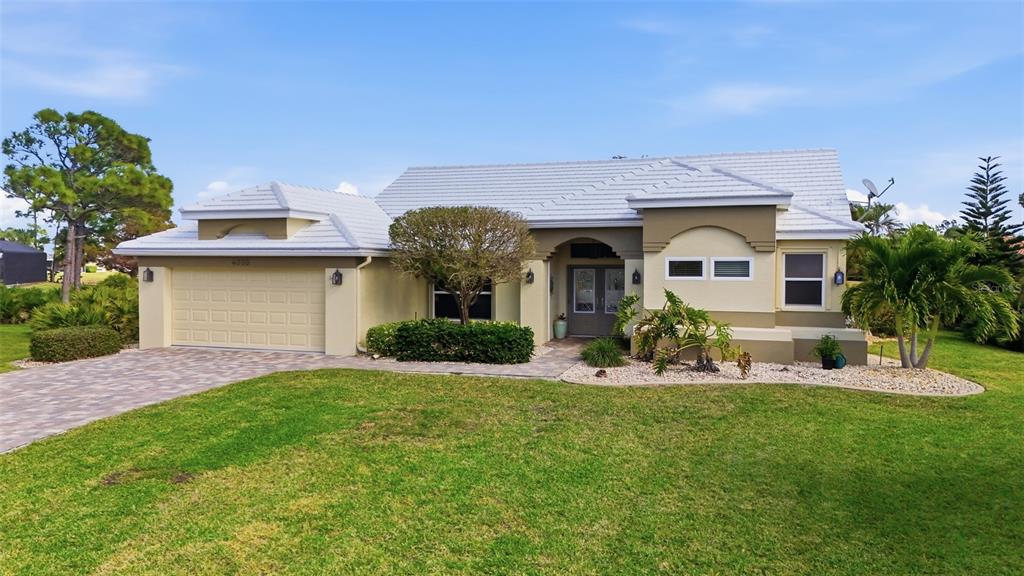 4030 Key Largo Lane Punta Gorda, FL 33955 - Photo 4 of 78 a front view of a house with a yard