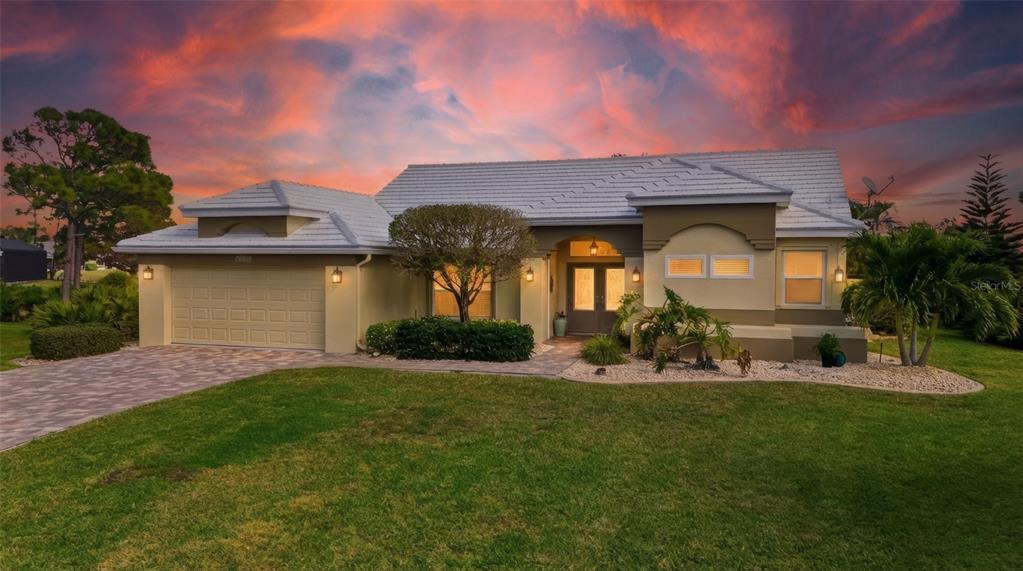 4030 Key Largo Lane Punta Gorda, FL 33955 - Photo 58 of 78 a front view of a house with a yard