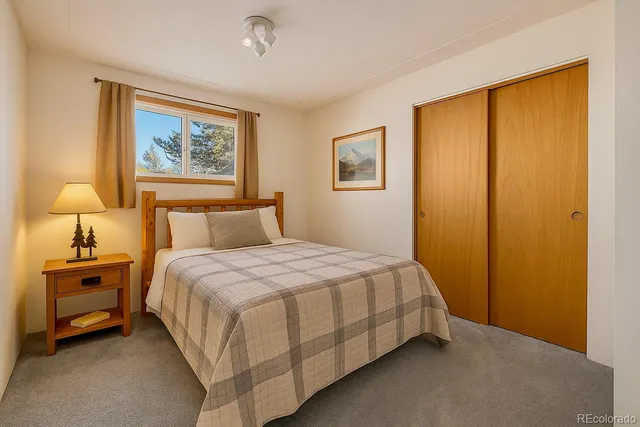 a view of a town with mountains in the background