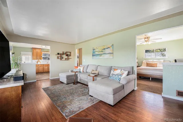 a kitchen with granite countertop a sink cabinets and appliances