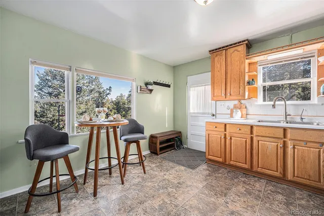 a view of a balcony with wooden floor and fence