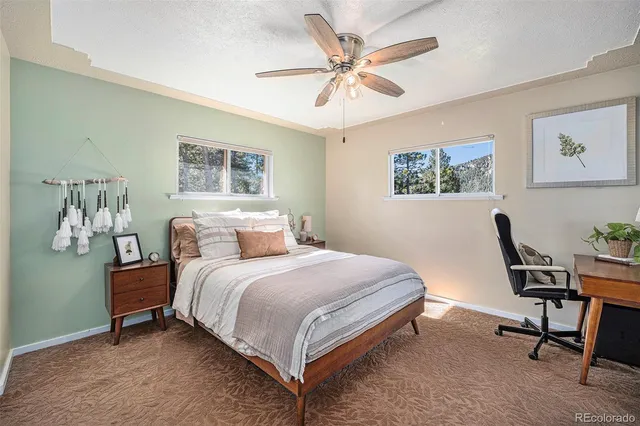 a bathroom with a granite countertop sink and a mirror a bathtub