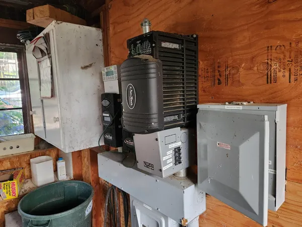 a view of a house with a small yard and sitting area