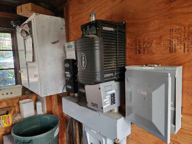 a view of a house with a small yard and sitting area
