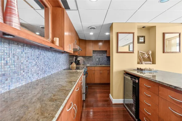 a kitchen with stainless steel appliances granite countertop a sink and cabinets