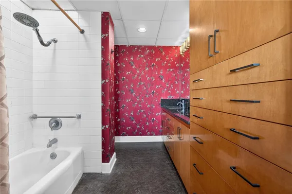 a bathroom with a sink and a mirror