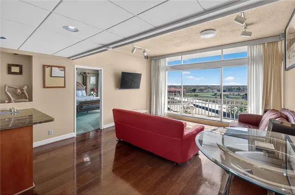 a living room with furniture and a large window