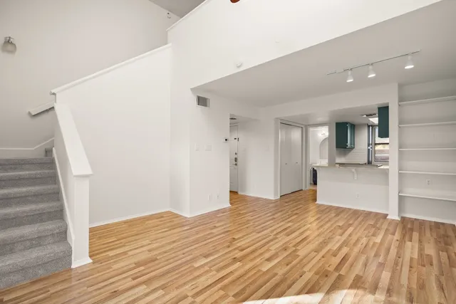 a kitchen with stainless steel appliances granite countertop a sink and a stove