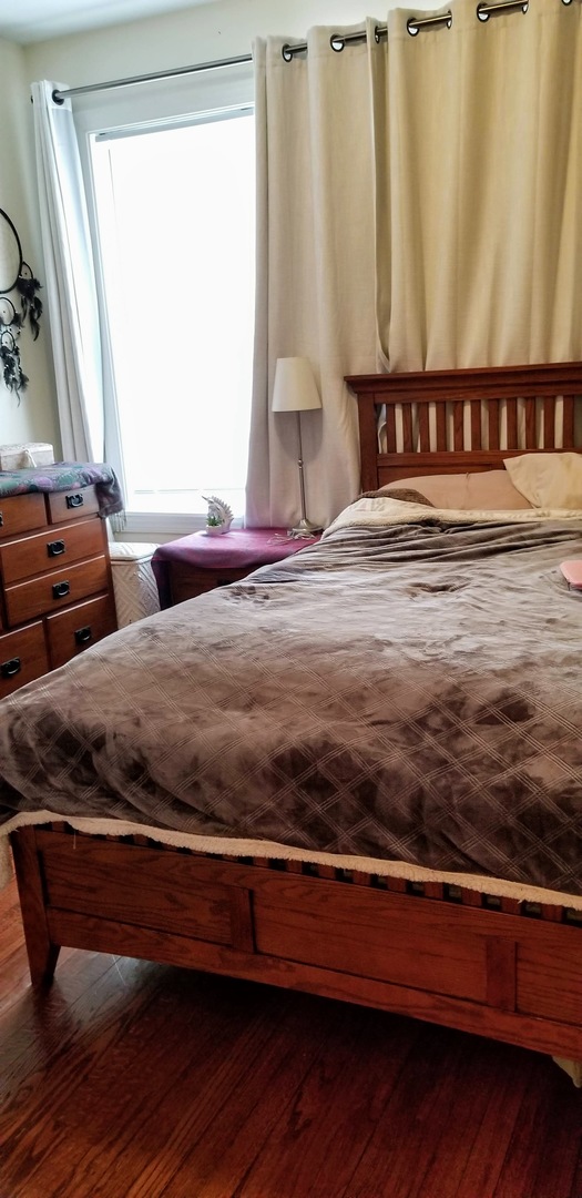 4751 North Virginia Avenue, Unit 2 Chicago, IL 60625 - Photo 5 of 8 a view of a room with furniture and a window