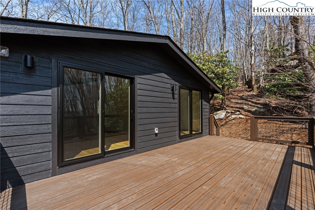 212 Chinkapin Ridge Road Seven Devils, NC 28604 - Photo 12 of 21 a front view of a house with a yard