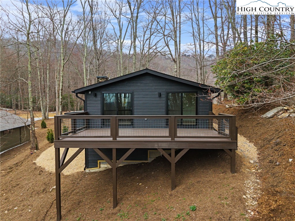 212 Chinkapin Ridge Road Seven Devils, NC 28604 - Photo 20 of 21 a house view with a outdoor space