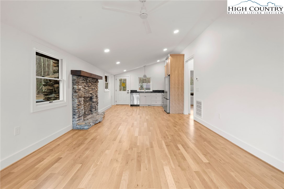 212 Chinkapin Ridge Road Seven Devils, NC 28604 - Photo 4 of 21 a view of empty room with wooden floor