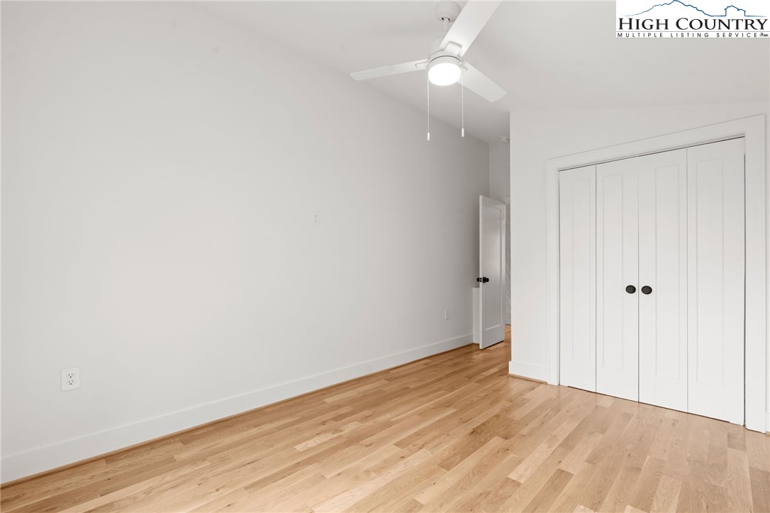 212 Chinkapin Ridge Road Seven Devils, NC 28604 - Photo 6 of 21 a view of an empty room with wooden floor