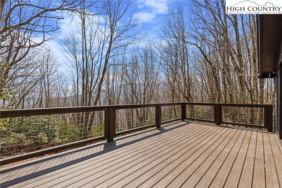 212 Chinkapin Ridge Road Seven Devils, NC 28604 - Photo 9 of 21 a view of balcony with wooden floor and fence