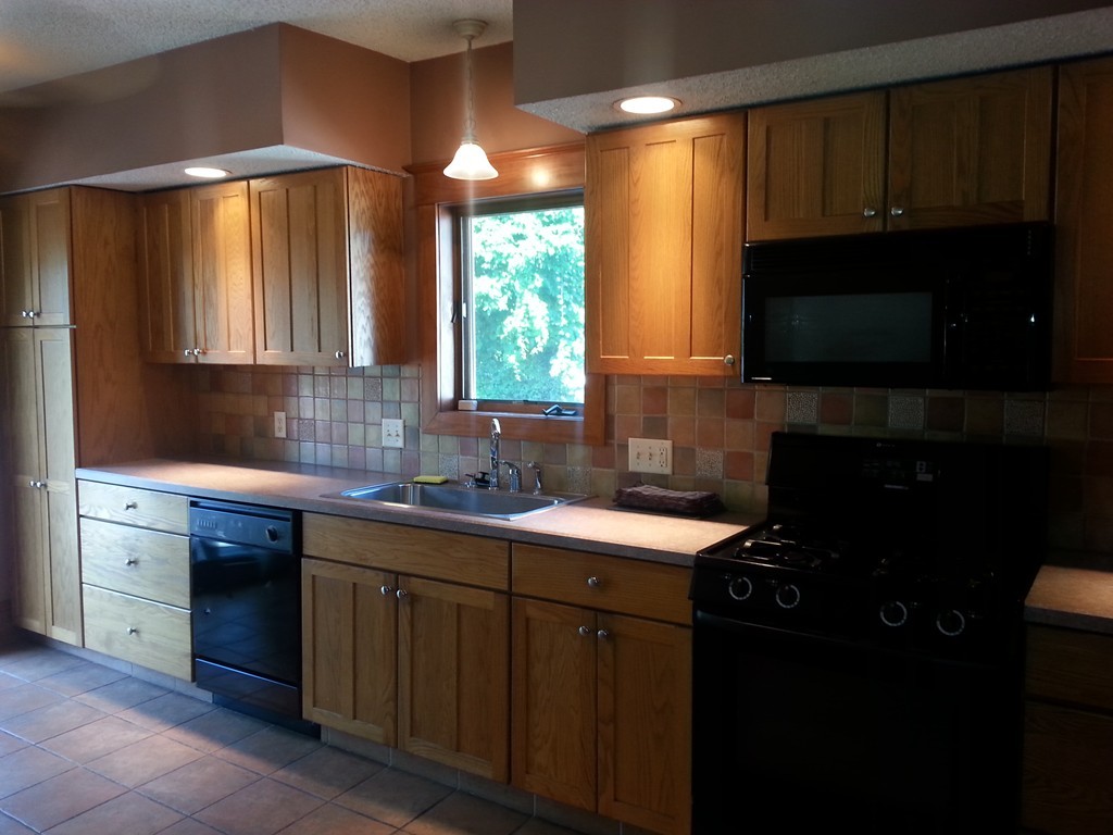 26 Lorenzo Street Springfield, MA 01109 - Photo 9 of 12 a kitchen with a sink a window and cabinets