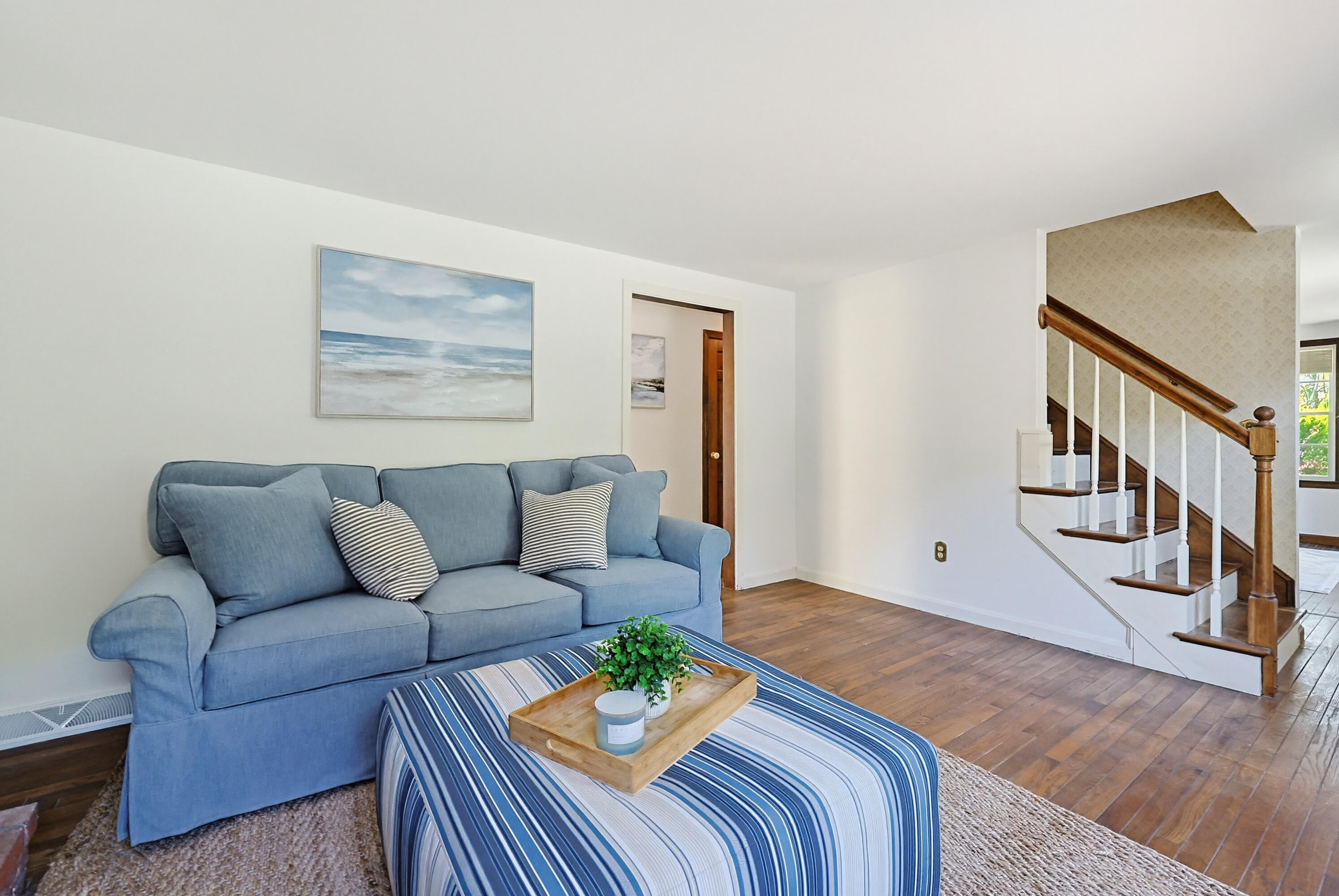 556 Cotuit Road Mashpee, MA 02649 - Photo 4 of 45 a living room with furniture and stairs