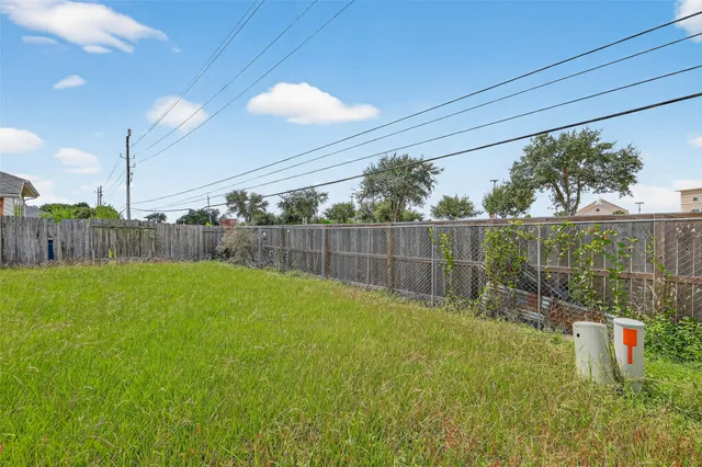 a view of a backyard with a swing