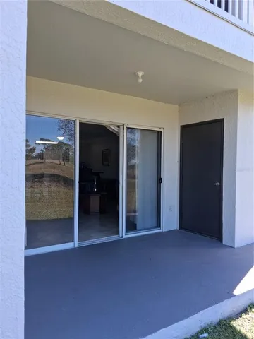 a view of wooden floor and brick wall