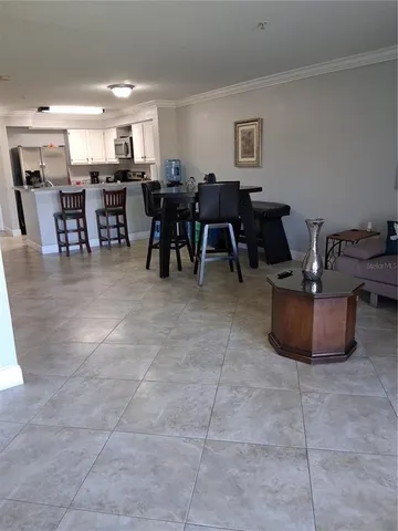 a dining hall with lots of tables and chairs