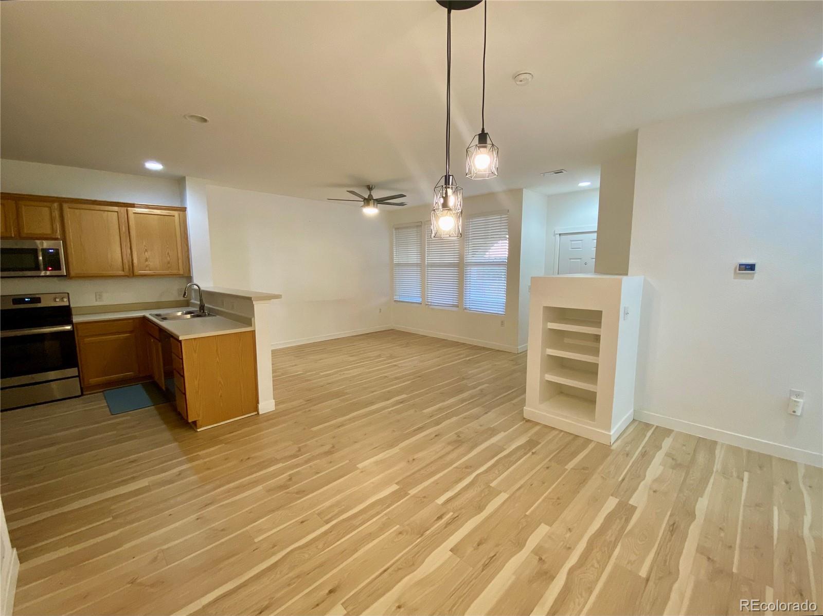 6722 South Winnipeg Circle, Unit 103 Aurora, CO 80016 - Photo 7 of 19 a view of a kitchen with a sink