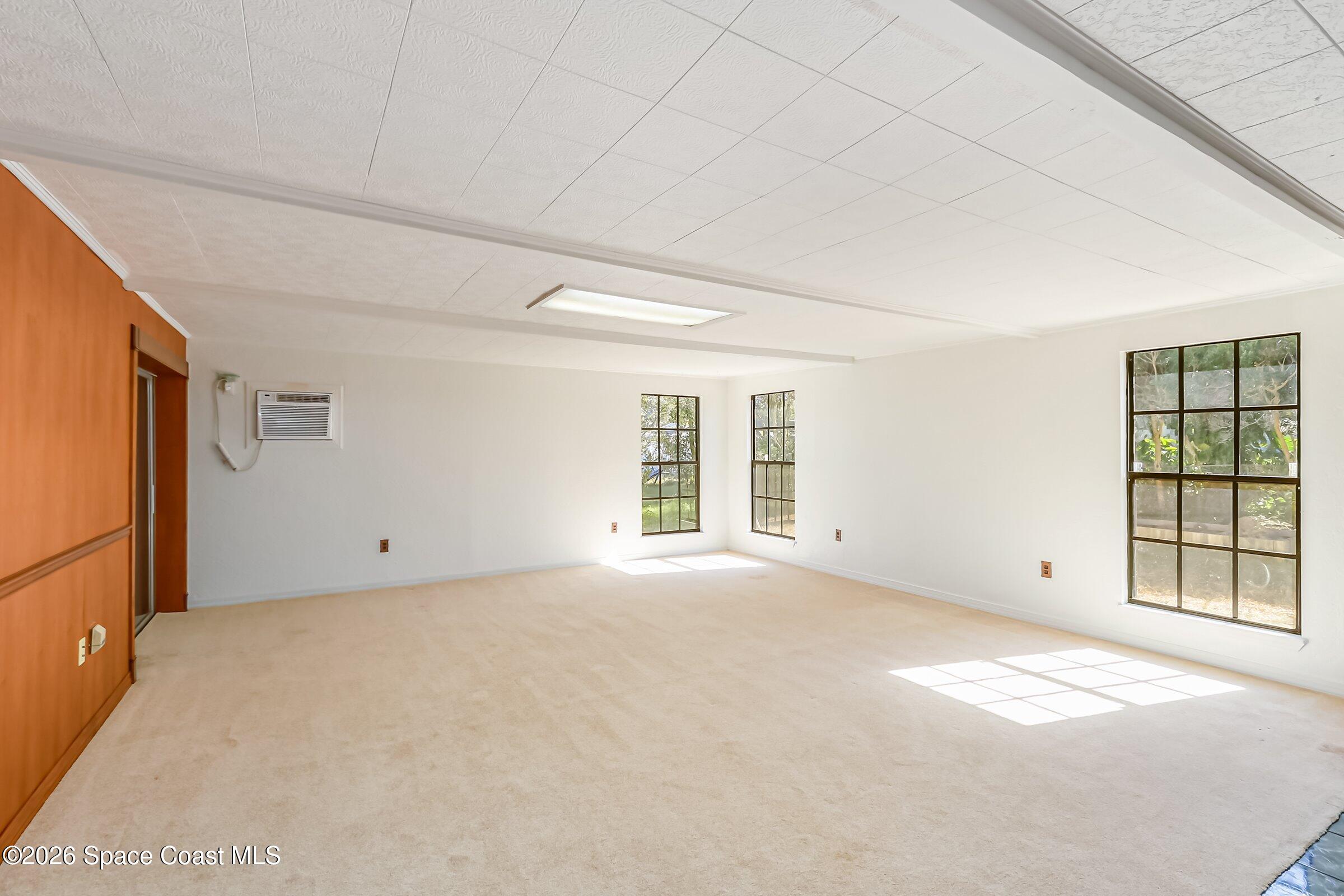 1275 Troon Way Rockledge, FL 32955 - Photo 22 of 62 Massive Rec Room with Fireplace