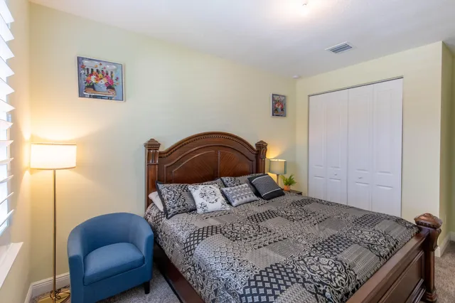 a bedroom with a bed and a dresser