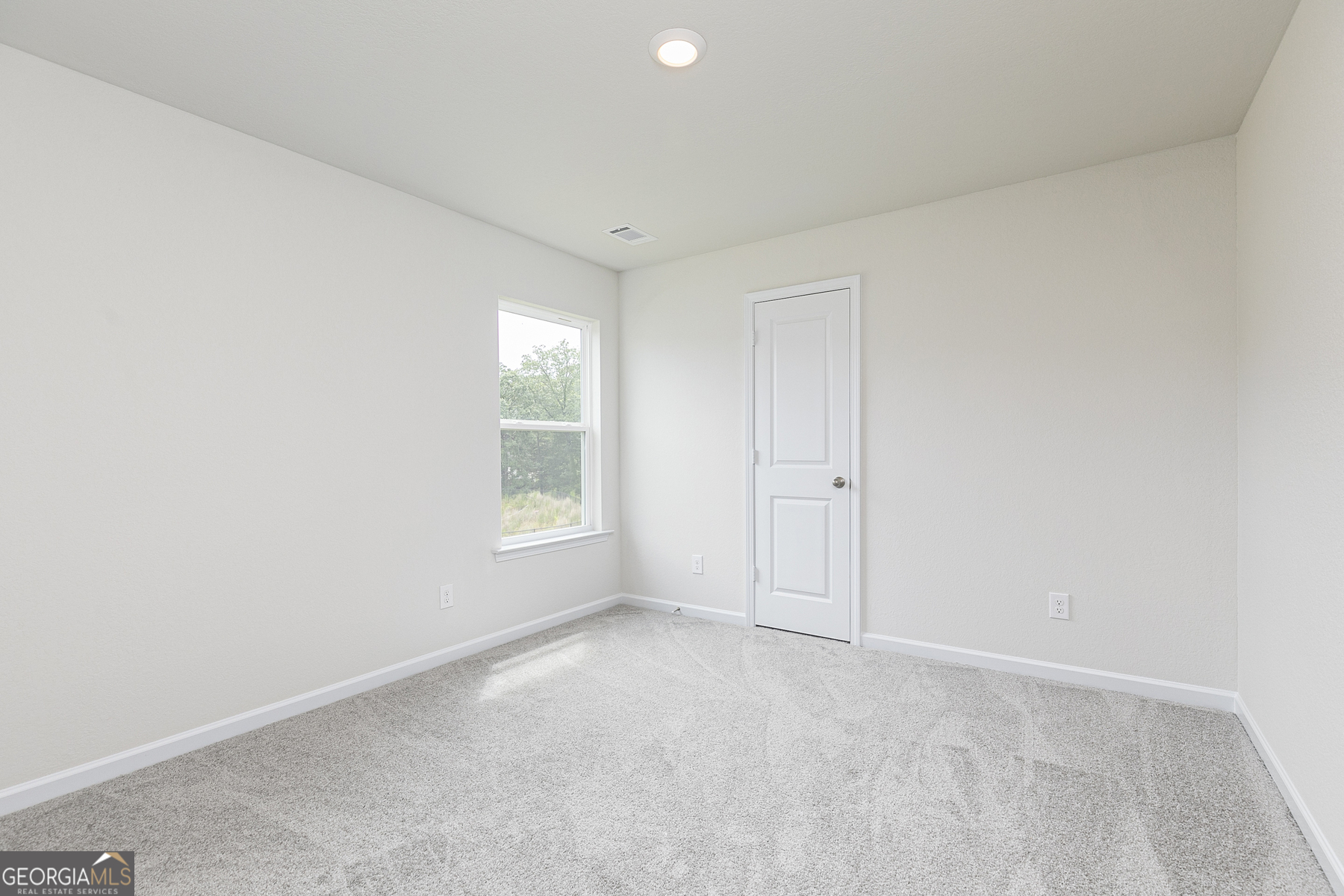 615 Slate Road Conyers, GA 30013 - Photo 20 of 21 a view of an empty room with a window